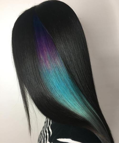 Long sleek black hair with vibrant purple blue peekaboo highlights hidden beneath dark strands