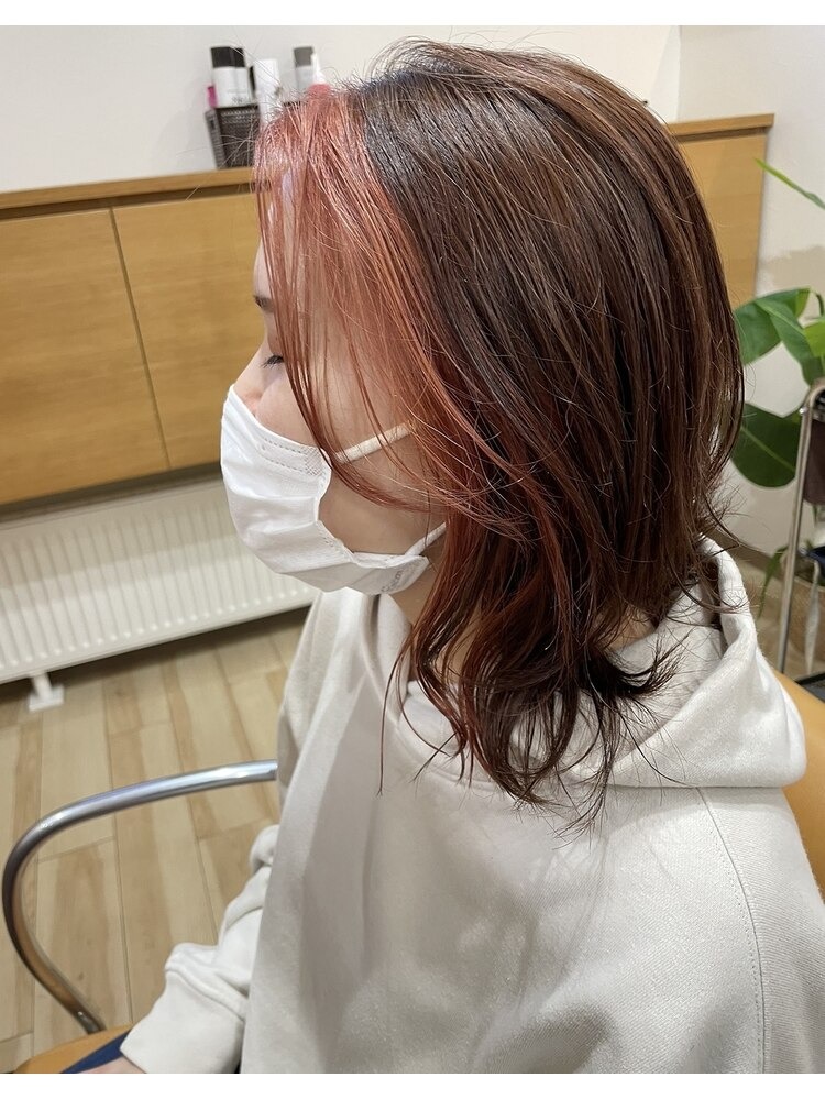 Coral pink highlights brown hair