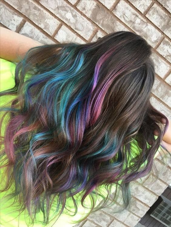 Dark brown waves with blue and purple highlights throughout the lengths