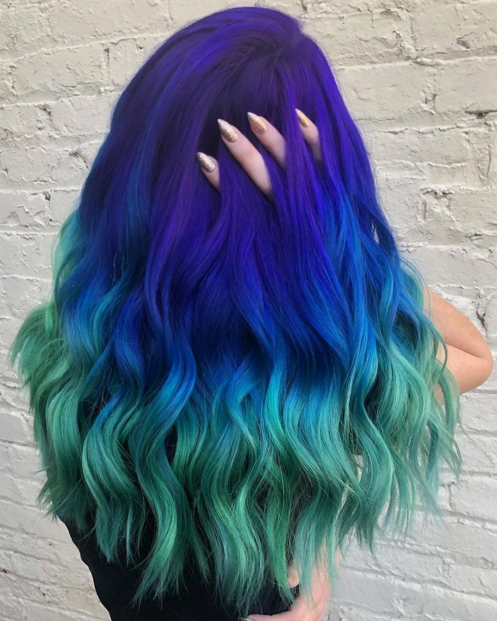Long mermaid waves blending purple and ocean blue into teal ends