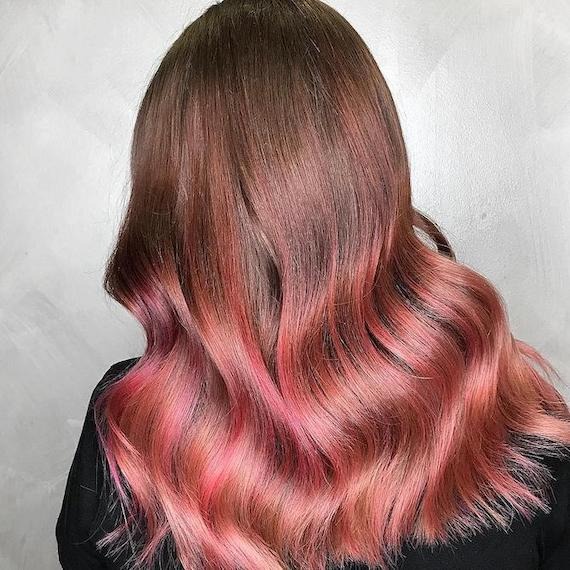 Soft pink color melt brunette hair